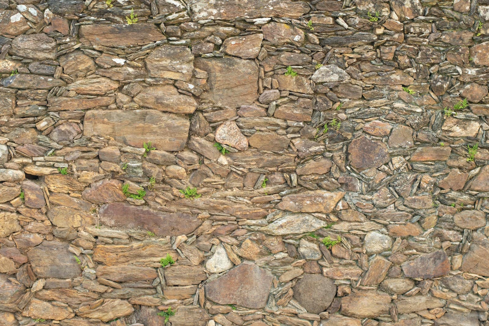 Rustic mixed stone wall construction detail